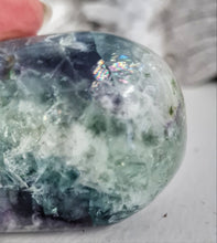 Load image into Gallery viewer, Feather Fluorite Palmstone with Rainbows