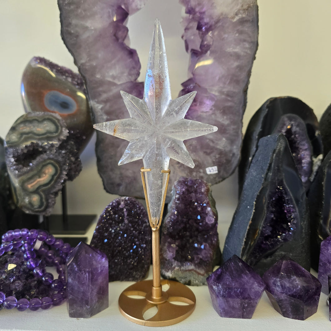Clear Quartz Polaris Star on stand.