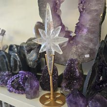 Load image into Gallery viewer, Clear Quartz Polaris Star on stand.
